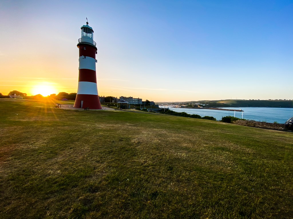 Plymouth Hoe and lighthouse at sunrise