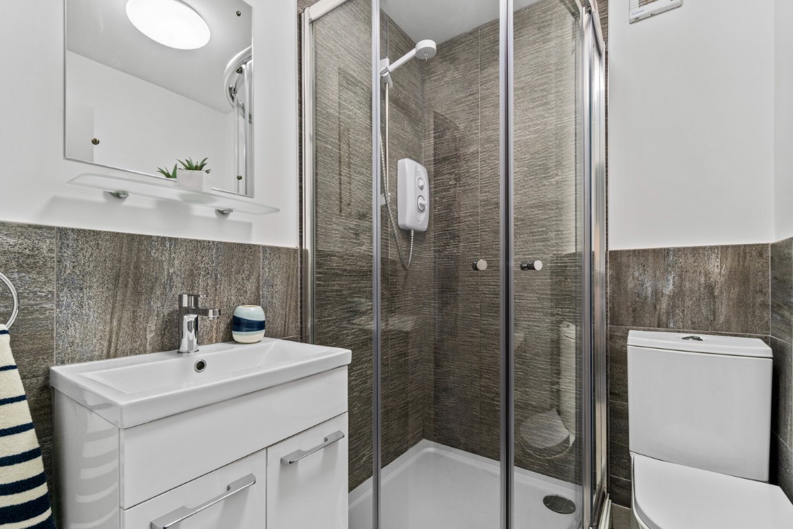 Modern tiled shower room grey